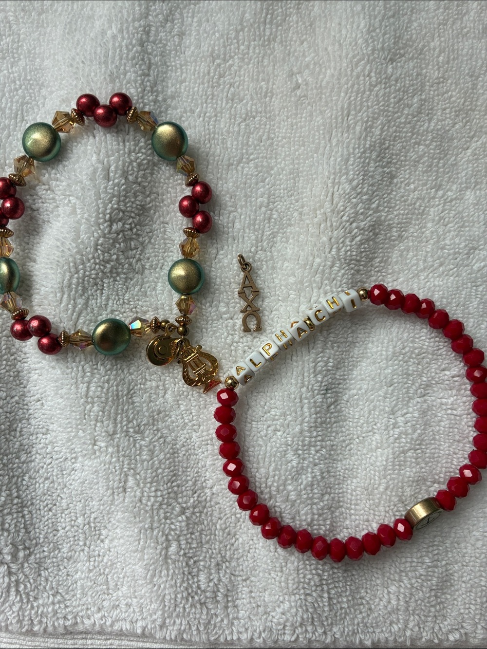 Two Alpha Chi Omega bracelets and one  gold AXO Lavalier